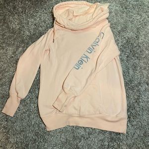 Baby pink calvin klein hoodie with a small stain